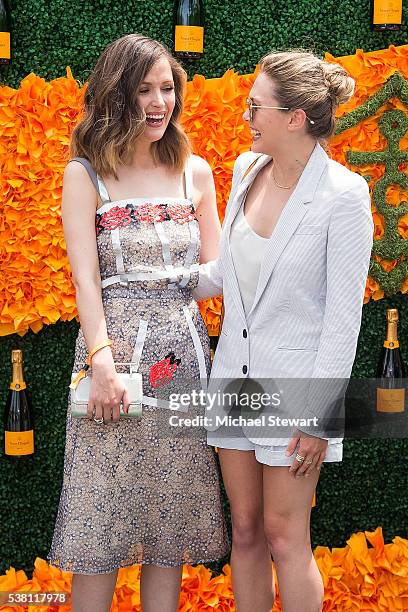 Actors Rose Byrne and Elizabeth Olsen attend the 2016 Veuve Clicquot Polo Classic at Liberty State Park on June 4, 2016 in Jersey City, New Jersey.