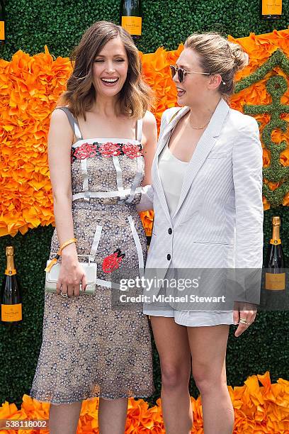Actors Rose Byrne and Elizabeth Olsen attend the 2016 Veuve Clicquot Polo Classic at Liberty State Park on June 4, 2016 in Jersey City, New Jersey.