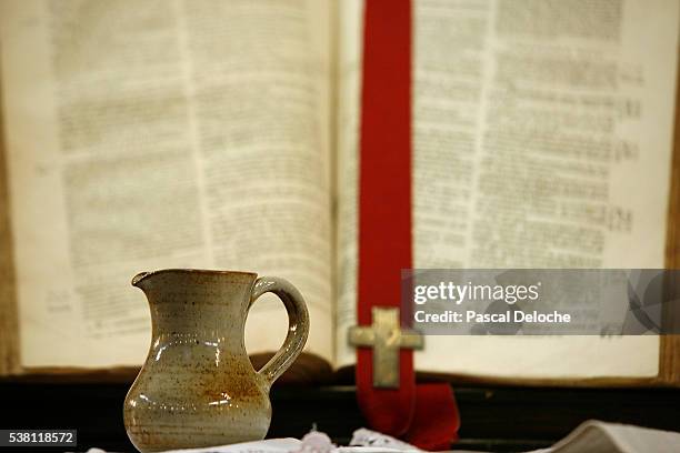 baptism water and protestant bible - baptism cross stock pictures, royalty-free photos & images