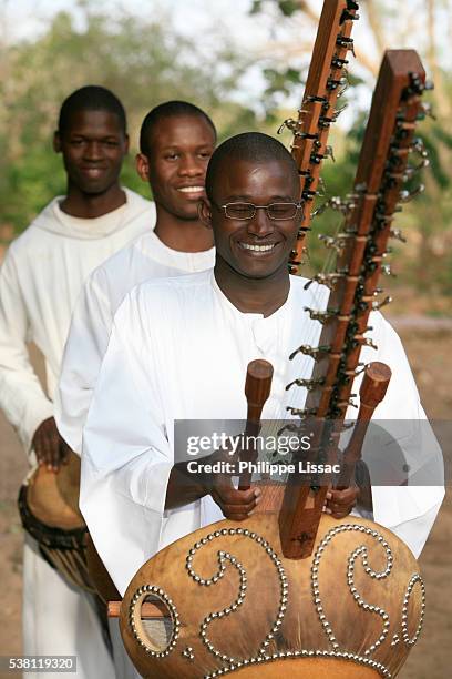 monks playing music in procession at keur moussa abbey - kora music stock pictures, royalty-free photos & images