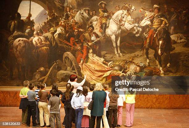 children looking at painting in budapest history museum - museum guide stock pictures, royalty-free photos & images