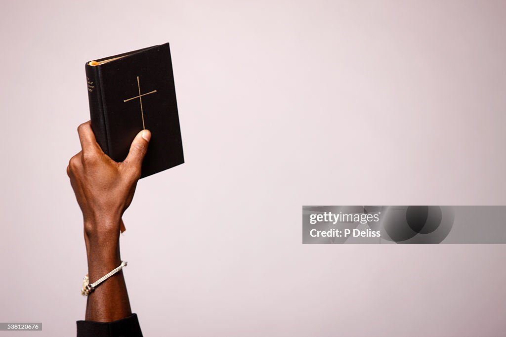 Man Holding Bible