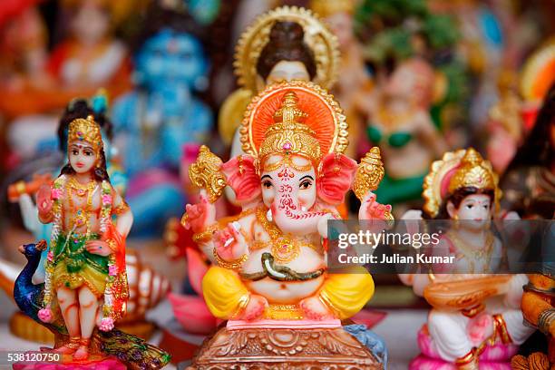 miniature indian statue of ganesh and other hindu deities - ganesha stock pictures, royalty-free photos & images