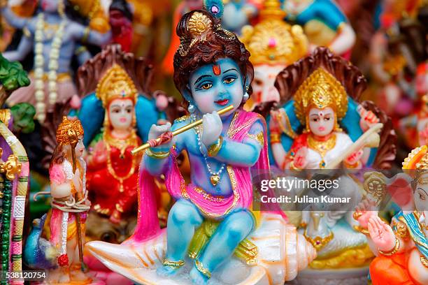 miniature indian statue of krishna and other hindu deities - krishna stock pictures, royalty-free photos & images