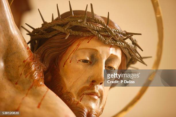 close-up view of crucifix at st. george's basilica - kreuzigung christi stock-fotos und bilder