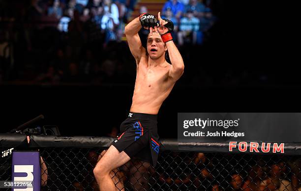 Brian Ortega celebrates after his TKO in the third round against Clay Guida in their featherweight bout during the UFC 199 event at The Forum on June...