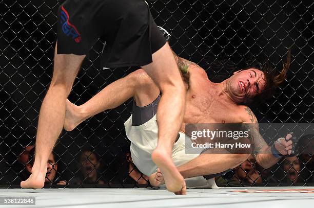Brian Ortega punches Clay Guida in their featherweight bout during the UFC 199 event at The Forum on June 4, 2016 in Inglewood, California.