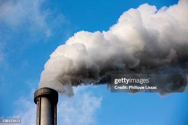 smoking smokestack - smoke stack stock pictures, royalty-free photos & images