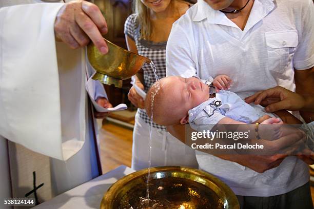 catholic baptism - catholic baptism stock-fotos und bilder