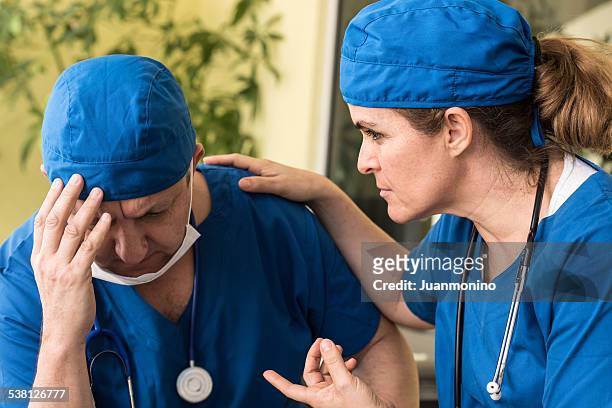 sad doctors - nurse meditating stock pictures, royalty-free photos & images