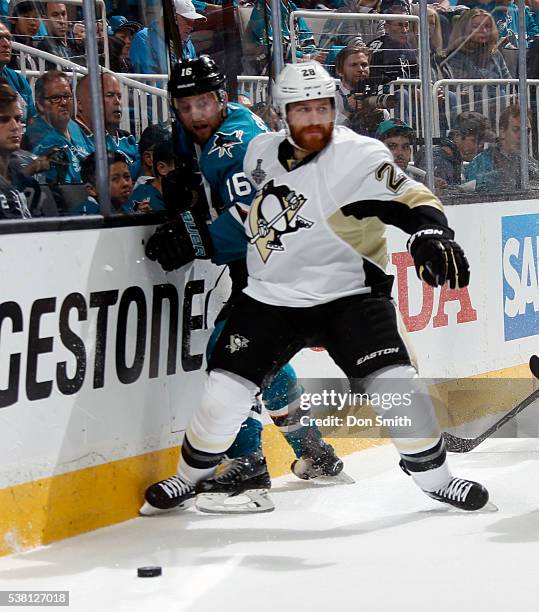 Ian Cole of the Pittsburgh Penguins screens off Nick Spaling of the San Jose Sharks from the puck in Game Three of the 2016 NHL Stanley Cup Final at...