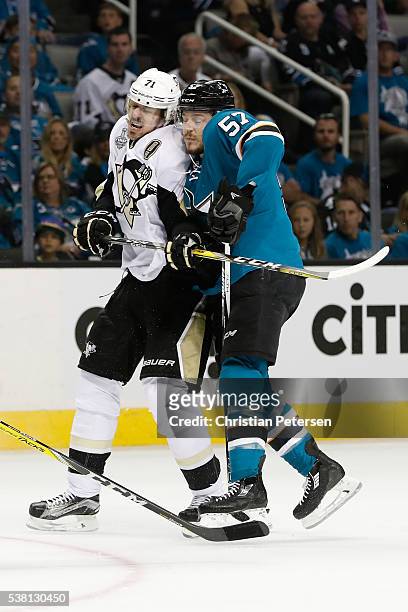 Evgeni Malkin of the Pittsburgh Penguins skates against Tommy Wingels of the San Jose Sharks during the second period in Game Three of the 2016 NHL...