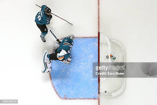 Martin Jones of the San Jose Sharks gives up a goal against Patric Hornqvist of the Pittsburgh Penguins with Brent Burns of the San Jose Sharks in...