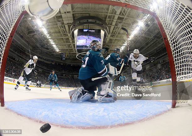 Conor Sheary of the Pittsburgh Penguins reacts after the puck went into the net past goaltender Martin Jones of the San Jose Sharks for a goal from...
