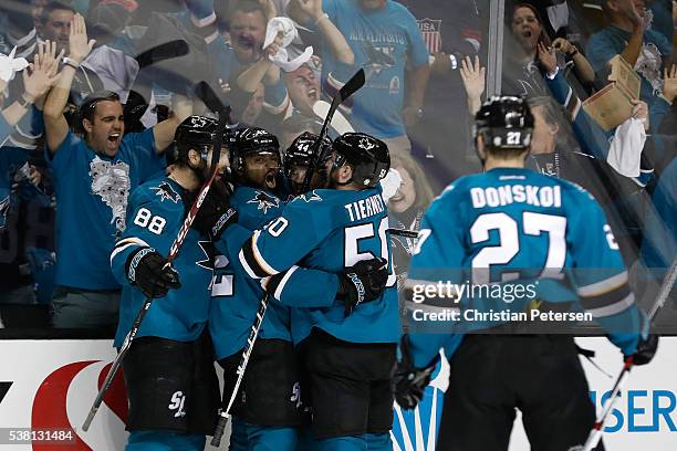 Joel Ward of the San Jose Sharks celebrates his goal with Brent Burns, Marc-Edouard Vlasic, Chris Tierney and Joonas Donskoi against the Pittsburgh...