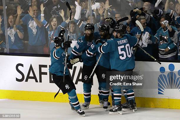 Joel Ward of the San Jose Sharks celebrates his goal with Brent Burns, Marc-Edouard Vlasic, Chris Tierney and Joonas Donskoi against the Pittsburgh...