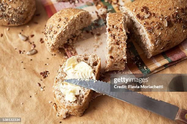 whole wheat bread with butter - butter stock pictures, royalty-free photos & images