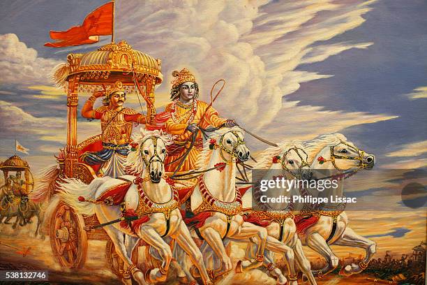 painting made at iskcon mayapura, india : krishna and arjuna on the battlefield of kuruksetra - krishna stock pictures, royalty-free photos & images