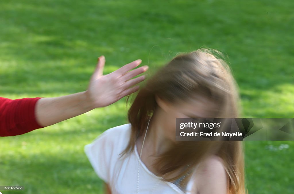 Woman slapping a child