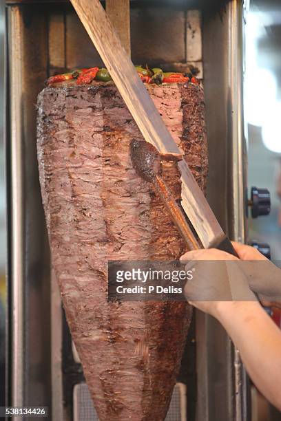doner kebab carving in istanbul's grand bazaar. - kebab stock pictures, royalty-free photos & images
