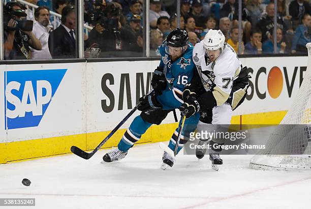Nick Spaling of the San Jose Sharks protects the puck from Evgeni Malkin of the Pittsburgh Penguins during the second period of Game Three of the...