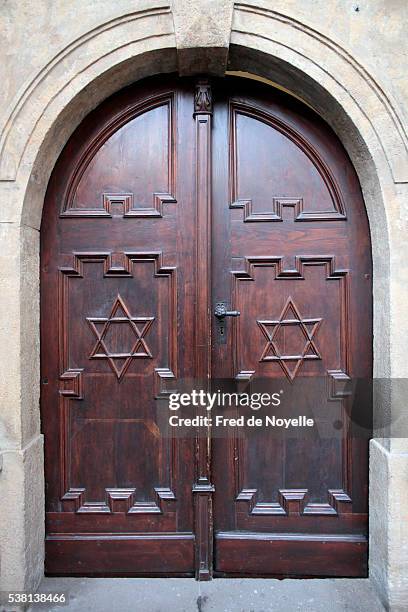 pinkas synagogue. memorial to the 80,000 jewish victims of the holocaust from bohemia and moravia. main door with stars of david - synagogue exterior stock pictures, royalty-free photos & images