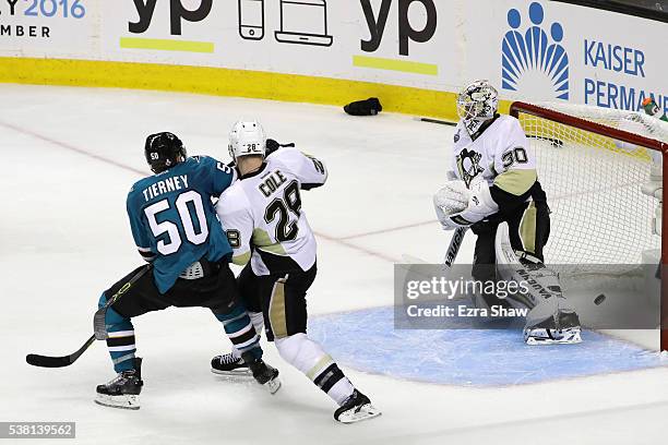 Matt Murray of the Pittsburgh Penguins gives up the game winning goal to Joonas Donskoi of the San Jose Sharks in front of Chris Tierney and Ian Cole...