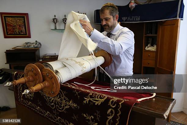 jewish torah scroll in a synagogue. - torah stock pictures, royalty-free photos & images