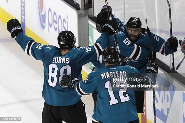 Joonas Donskoi of the San Jose Sharks celebrates his game winning goal with Chris Tierney, Brent Burns and Patrick Marleau against the Pittsburgh...