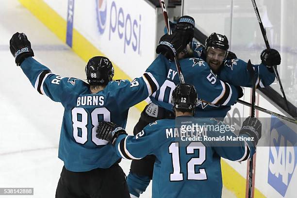 Joonas Donskoi of the San Jose Sharks celebrates his game winning goal with Chris Tierney, Brent Burns and Patrick Marleau against the Pittsburgh...