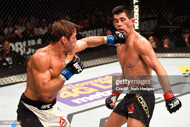 Urijah Faber throws a left punch at Dominick Cruz in their UFC bantamweight championship bout during the UFC 199 event at The Forum on June 4, 2016...