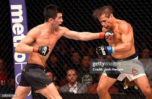 Dominick Cruz throws a left punch at Urijah Faber in their UFC bantamweight championship bout during the UFC 199 event at The Forum on June 4, 2016...