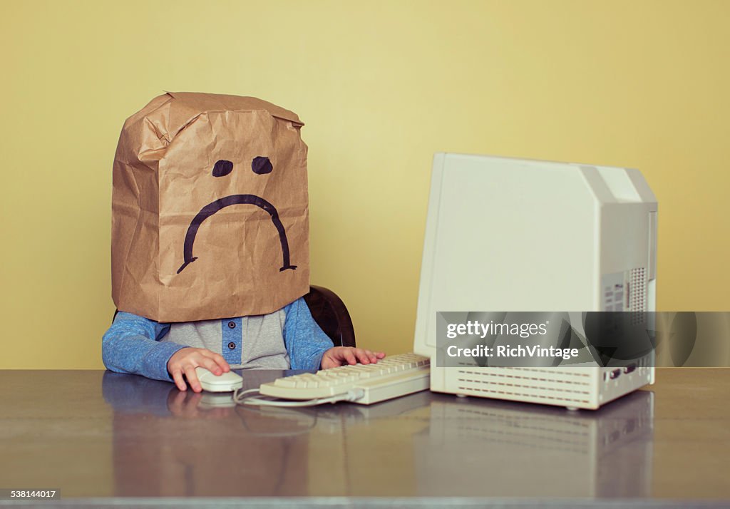 Young Boy in Front of Computer is Cyber Bullying Victim