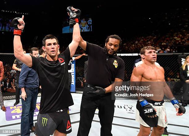 Dominick Cruz celebrates after defeating Urijah Faber by unanimous decision in their UFC bantamweight championship bout during the UFC 199 event at...