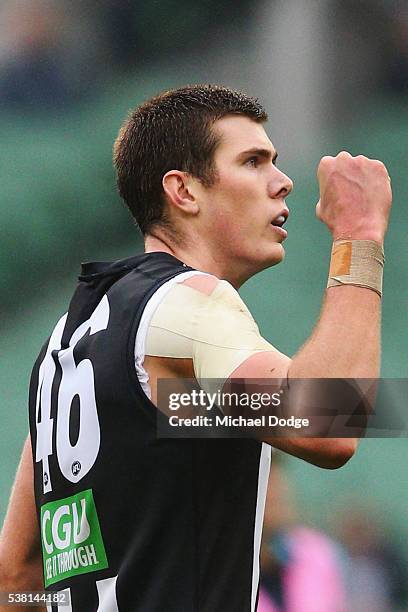 Mason Cox of the Magpies celebrates a goal during the round 11 AFL match between the Collingwood Magpies and the Port Adelaide Power at Melbourne...