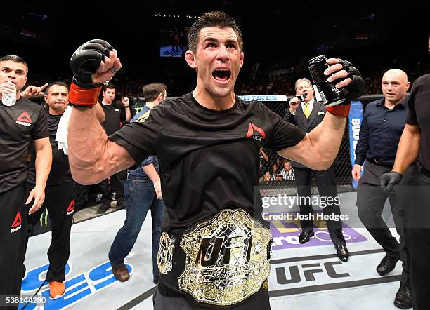 Dominick Cruz celebrates after defeating Urijah Faber by unanimous decision in their UFC bantamweight championship bout during the UFC 199 event at...