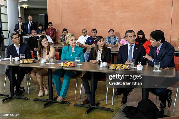 Congressman Xavier Becerra, left, Clara Kim, Democratic presidential candidate Hillary Clinton, Italia Garcia, Mayor Eric Garcetti and California's...