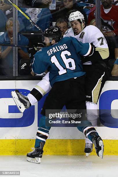 Nick Spaling of the San Jose Sharks hits Evgeni Malkin of the Pittsburgh Penguins in Game Three of the 2016 NHL Stanley Cup Final at SAP Center on...