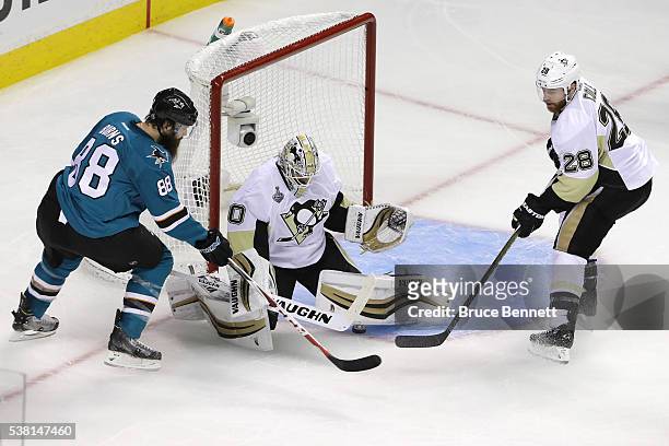 Matt Murray of the Pittsburgh Penguins makes the save on Brent Burns of the San Jose Sharks in Game Three of the 2016 NHL Stanley Cup Final at SAP...
