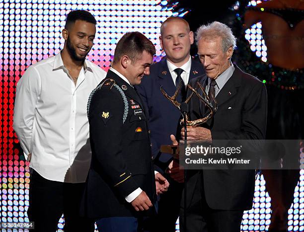 Honorees Anthony Sadler, Specialist Alek Skarlatos, and Airman First Class Spencer Stone accept the Hero Award from actor/director Clint Eastwood...