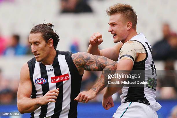 Ollie Wines of the Power reacts after Jesse White of the Magpies misses an easy kick for goal during the round 11 AFL match between the Collingwood...