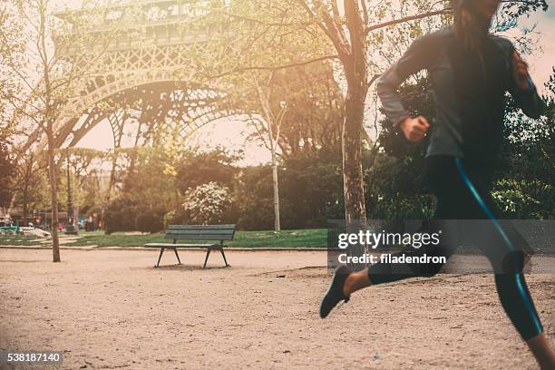 running in paris - champs de mars stock pictures, royalty-free photos & images