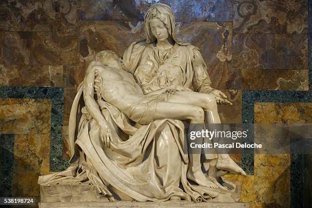 michaelangelo's pieta sculpture. 1499. st. peter's basilica. - pieta stock pictures, royalty-free photos & images