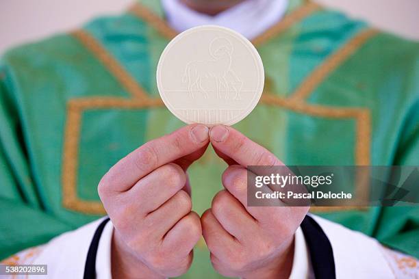 catholic mass. celebration of the eucharist. - communion stock pictures, royalty-free photos & images
