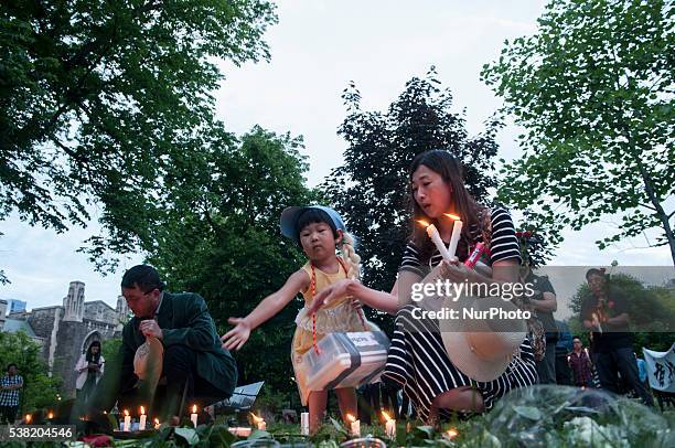 Chinese residents in Toronto stand outside the Chinese embassy on 04 June 2016 to commemorate the 27th anniversary of the Tiananmen pro-democracy...