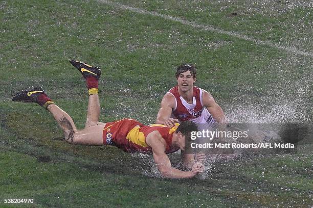 Tom Lynch of the Suns competes for the ball against Dane Rampe of the Swans during the round 11 AFL match between the Gold Coast Suns and the Sydney...