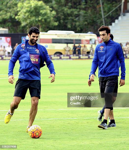 Indian Bollywood actors Aditya Roy Kapur and Ranbir Kapoor take part in the Celebrity Clasico 2016 charity football match organized by the Virat...