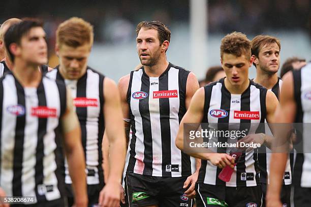 Travis Cloke of the Magpies looks dejected after defeat during the round 11 AFL match between the Collingwood Magpies and the Port Adelaide Power at...