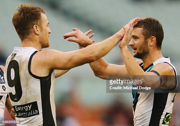 Robbie Gray of the Power celebrates a goal with Sam Gray during the round 11 AFL match between the Collingwood Magpies and the Port Adelaide Power at...