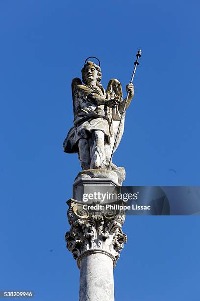 60m-high tower crowned with the statue of the archangel raphael, who is the patron saint of the city of cordoba - archangel raphael stock pictures, royalty-free photos & images